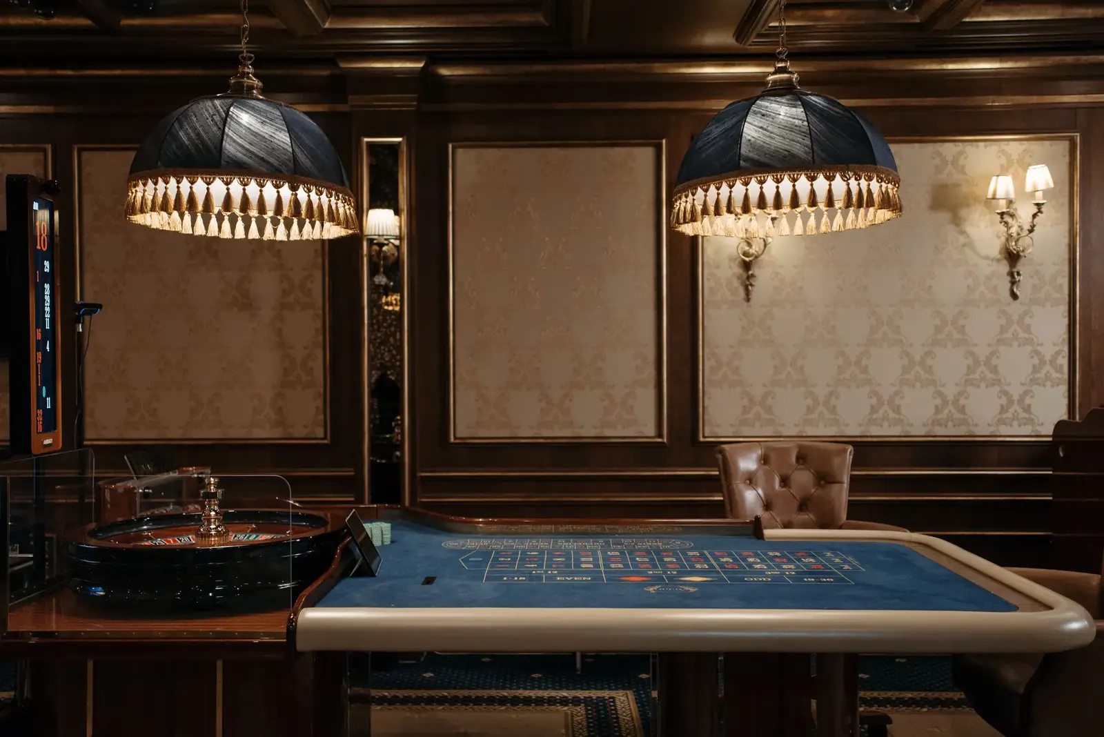 Refined physical casino interior with classic gaming tables and elegant lighting